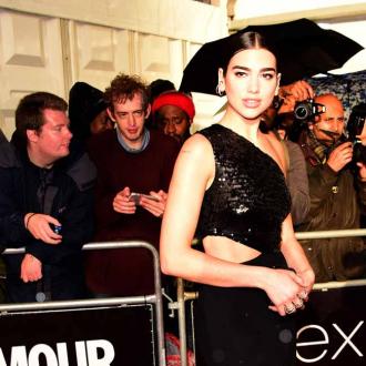 Dua Lipa does a 'secret handshake' before she goes on stage