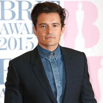 Orlando Bloom flirts with Paula Patton