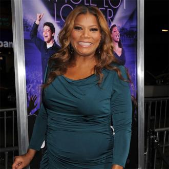 Queen Latifah thrilled to swim with sharks