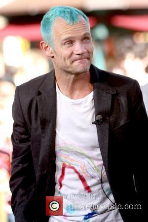 Flea aka Michael Peter Balzary Red Hot Chili Peppers film an interview for the entertainment television news programme 'Extra' at...