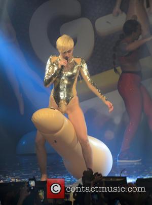 Miley Cyrus - Miley Cyrus performs live at G-A-Y. At one point during her set the singer presented her friend...