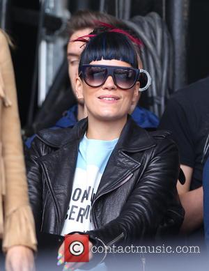 Lily Allen - Lily Allen and Nick Grimshaw watch One Direction's performance on the Main Stage of the Radio 1...