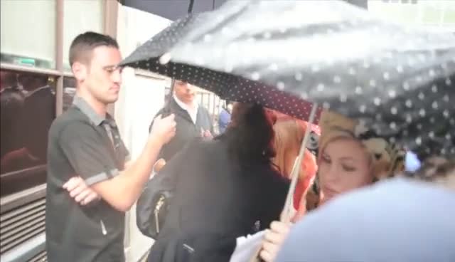 Tulisa Contostvalos Meets Fans In The Pouring Rain