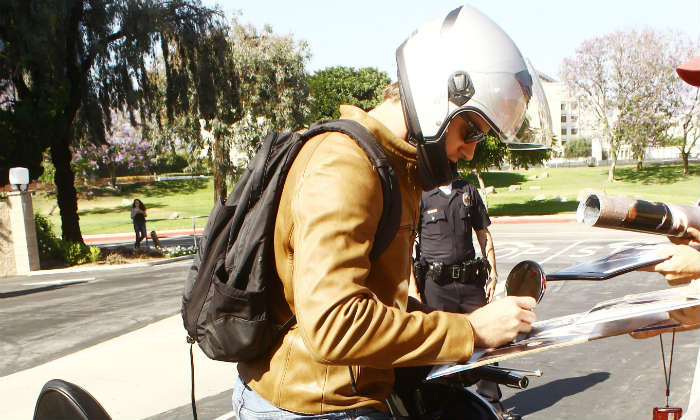 Armie Hammer signs autographs on his Vespa (2013)