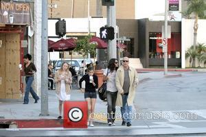 Bruce Willis, her girlfriend, daughter Tallulah Belle Willis pick up coffee at Starbucks and walk along Robertson Boulevard to go...