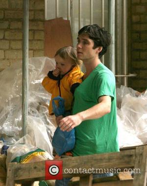 Cillian Murphy goes out with his son to the buy some groceries, wearing an anorak in case of rainfall London,...