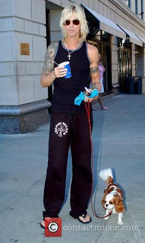 Duff McKagan of Velvet Revolver taking his dog for a morning walk in Midtown, Manhattan New York City, USA -...