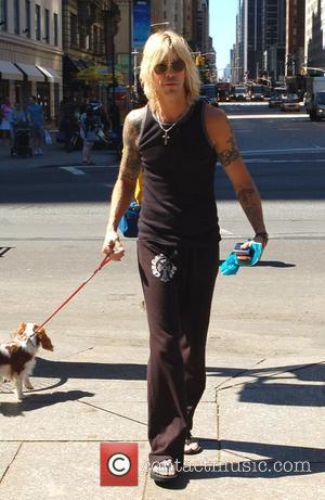 Duff McKagan of Velvet Revolver taking his dog for a morning walk in Midtown, Manhattan New York City, USA -...