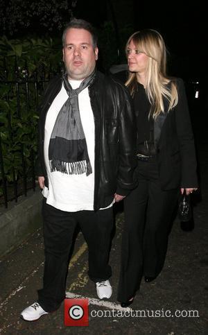 Chris Moyles and his girlfriend leaving the Universal records afterparty for the Brit Awards, held at the Hemple Hotel. London,...