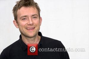 Damon Albarn The Good, The Bad and the Queen backstage at the 'Love Music Hate Racism Carnival' held in Victoria...