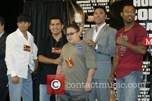Oscar De La Hoya meets Cruz Baraja as party of the Make A Wish Foundation. The foundation makes it possible...