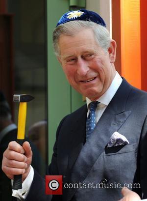 Prince Charles, Prince of Wales, wearing a Jewish yarmulka, smiles as he opens the Krakow Jewish Community Centre Krakow, Poland...