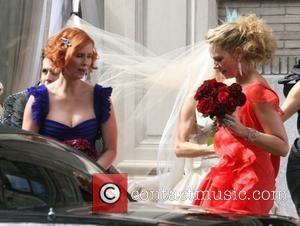 Kim Catrall and Cynthia Nixon filming a wedding scene for 'Sex And The City: The Movie' New York City, USA...