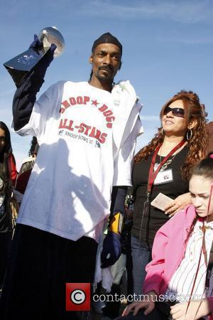 Snoop Dog holding the Snoop Bowl Trophy Snoop Bowl VI at Hamilton High School Chandler, Arizona 02.02.08