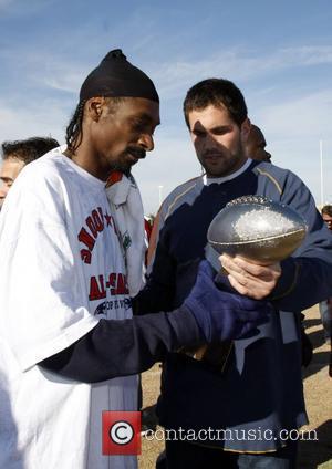 Snoop Dogg and Matt Leinart holding the Snoop Bowl Trophy. Snoop Bowl VI at Hamilton High School Chandler, Arizona 02.02.08