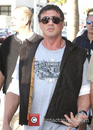 Sylvester Stallone walking around Beverly Hills where he bumps into Tom Arnorld Los Angeles, California - 16.02.08