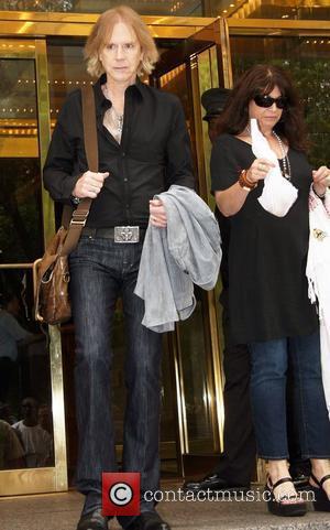 Tom Hamilton and wife Terry Cohen guitarist of legendary band Aerosmith leaving his Manhattan hotel New York City, USA -...