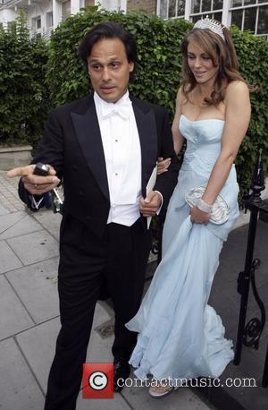 Arun Nayar and Elizabeth Hurley  leaving home to attend Elton John's party London, England - 26.06.08