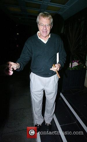 Jerry Springer  smokes a cigar outside the Dorchester Hotel London, England - 24.06.08