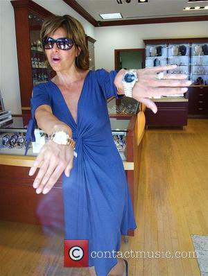 A bra-less Lisa Rinna buys two Rolex watches for her husband from Beverly Hills Watch Company Los Angeles, California -...