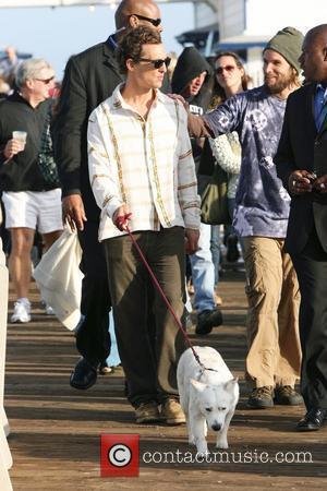 Matthew McConaughey walking his dog at the Surfrider Art and Music Festival on Malibu Pier. Matthew joined the band for...