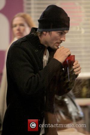 Ashton Kutcher takes a sip of his drink at the 2009 Sundance Film Festival, Day 2 Park City, Utah -...