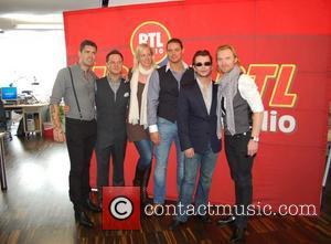 Shane Lynch, Mikey Graham, Juliane Rasche, Keith Duffy, Stephen Gately and Ronan Keating visit 104.6 RTL Radio station in Berlin....