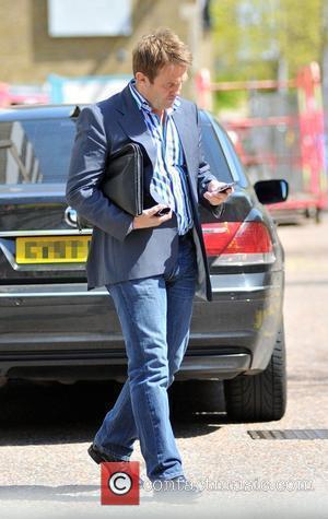 Bradley Walsh checking his phone while leaving the ITV studios London, England - 30.04.09