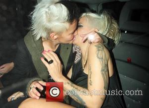 Jodie Marsh and her girlfriend Nina kiss in the back of a taxi after leaving Chinawhite nightclub London, England -...