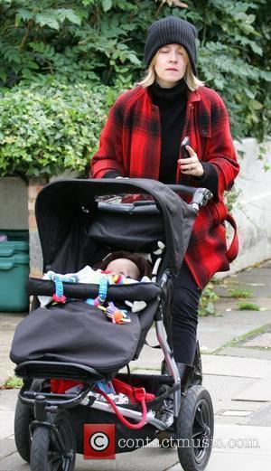 Edith Bowman pushes her son Rudy in a pushchair in North London London, England - 24.10.08