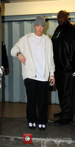 Eminem showing his middle finger to photographers when leaving a recording studio  London, England - 12.05.09