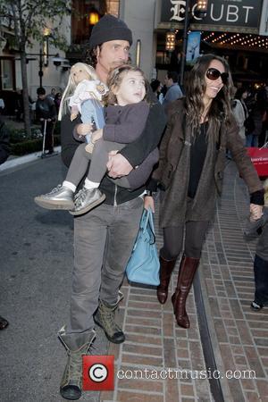 Chris Cornell and Vicky Karayiannis Chris Cornell visiting Santa's Grotto at The Grove with his family  Los Angeles, California...