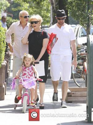 Hugh Jackman and his wife Deborra-Lee Furness take their daughter Ava Jackman out on her bike. New York City, USA...
