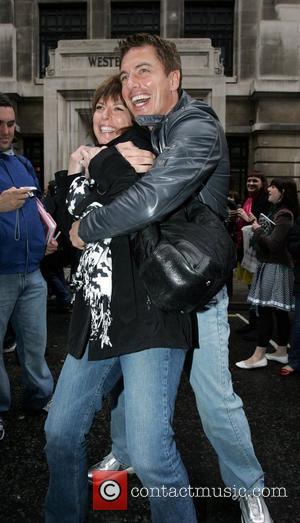 John Barrowman  hugs his sister as he leaves the BBC Radio Two studios. London, England - 11.04.09