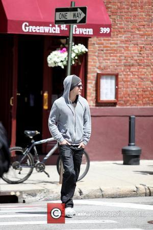 Justin Timberlake  wearing a grey hoodie and sunglasses walking in SoHo New York City, USA - 11.05.09