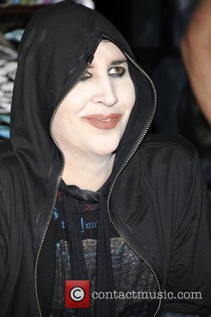 Marilyn Manson signs copies of his new album 'The High End of Low' at Hot Topic Hollywood Los Angeles, California...