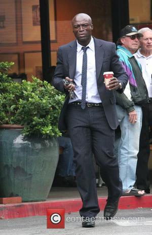 Singer Seal wearing a smart pinstriped suit leaving Starbucks Beverly Glen coffee store in Beverly Hills, California - 25.11.08