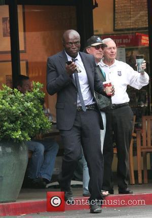 Singer Seal wearing a smart pinstriped suit leaving Starbucks Beverly Glen coffee store in Beverly Hills, California - 25.11.08