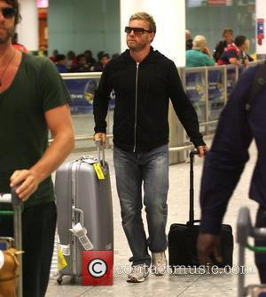 Gary Barlow of Take That arriving at London's Heathrow airport after a night flight from LAX international London, England -...