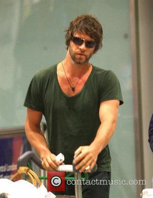 Howard Donald from Take That arriving at London's Heathrow airport after a night flight from LAX international London, England -...