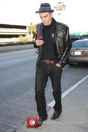 Daniel Day-Lewis arriving at LAX airport while wearing a Ben Sherman hat Los Angeles, California - 18.11.09