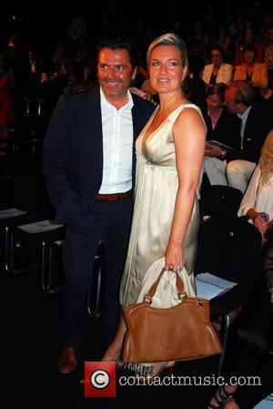 Thomas Anders and wife Claudia Gant fashion show at the fashion tent at Bebelplatz Mercedes Benz Fashion Week Berlin Spring/Summer...