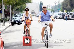 Billy Zane  and his girlfriend ride bicycles in Beverly Hills Los Angeles, California - 28.08.09