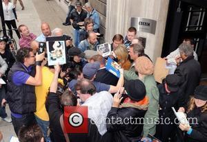 Olivia Newton-John  signs autographs outside the BBC Radio 2 studios with her husband John Easterling  London, England -...