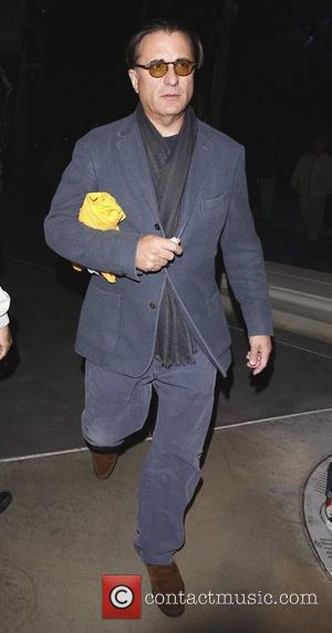 Andy Garcia leaves the Staples Center with a friend after watching the LA Lakers play the Clippers Los Angeles, California...