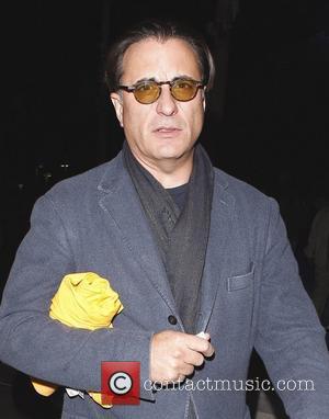 Andy Garcia leaves the Staples Center with a friend after watching the LA Lakers play the Clippers Los Angeles, California...