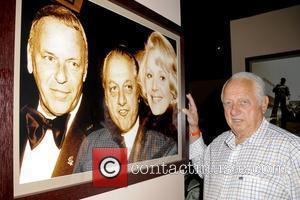 Tommy Lasorda with photo of himself and Frank Sinatra  at the ESPY Awards Gifting Suite at Dodgers Stadium...