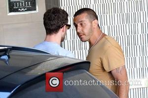 Justin Timberlake is harassed by an aggressive paparazzi as he arrives at his hotel Los Angeles, California - 14.07.09