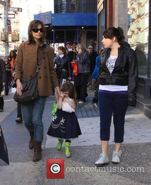 Katie Holmes, daughter Suri Cruise and step-daughter Isabella Cruise walking through New York, on their way to Balthazar restaurant New...