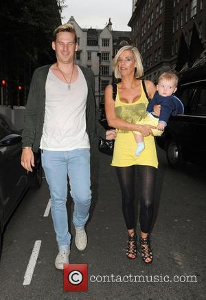 Lee Ryan and his fiancee Samantha Miller pull faces at photographers while out and about with their son Rayn Amethyst...